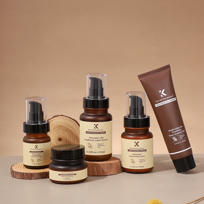 Five Keratine queen moisturizing skincare products in brown packaging arranged on decorative wooden slices.